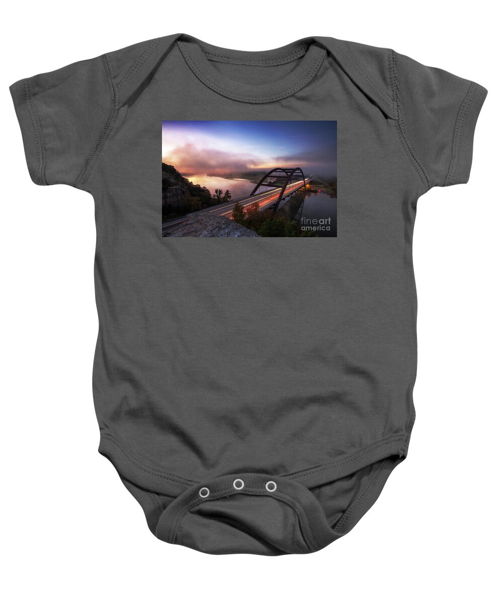 360 Bridge Baby Onesie featuring the photograph Fog rolls over the 360 Bridge during sunrise on a cold winters morning on Lake Austin, Texas by Dan Herron
