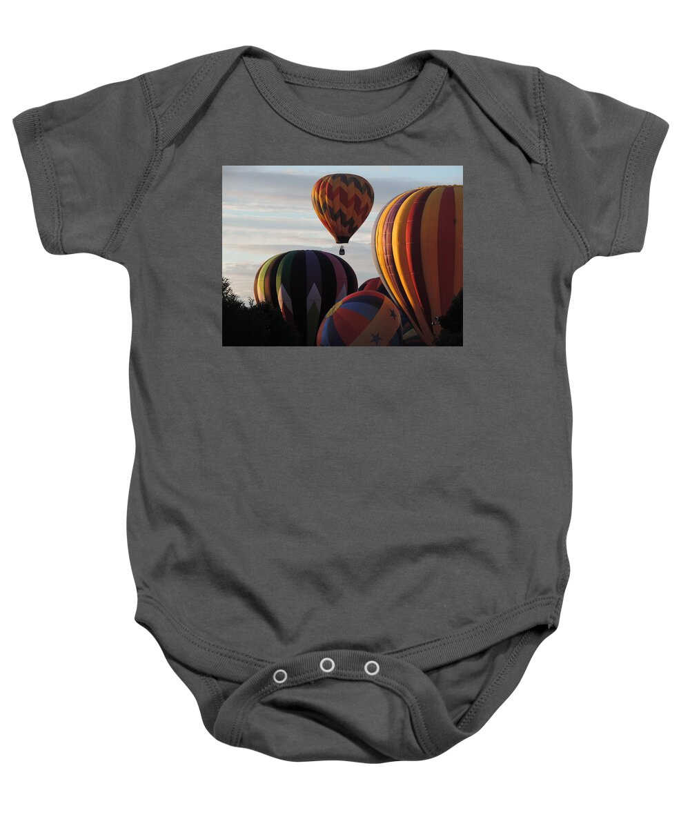 Balloons Baby Onesie featuring the photograph Into the Dawn Sky by Bill Tomsa