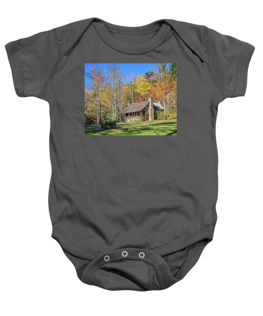 Brevard Baby Onesie featuring the photograph Log cabin by Jane Luxton
