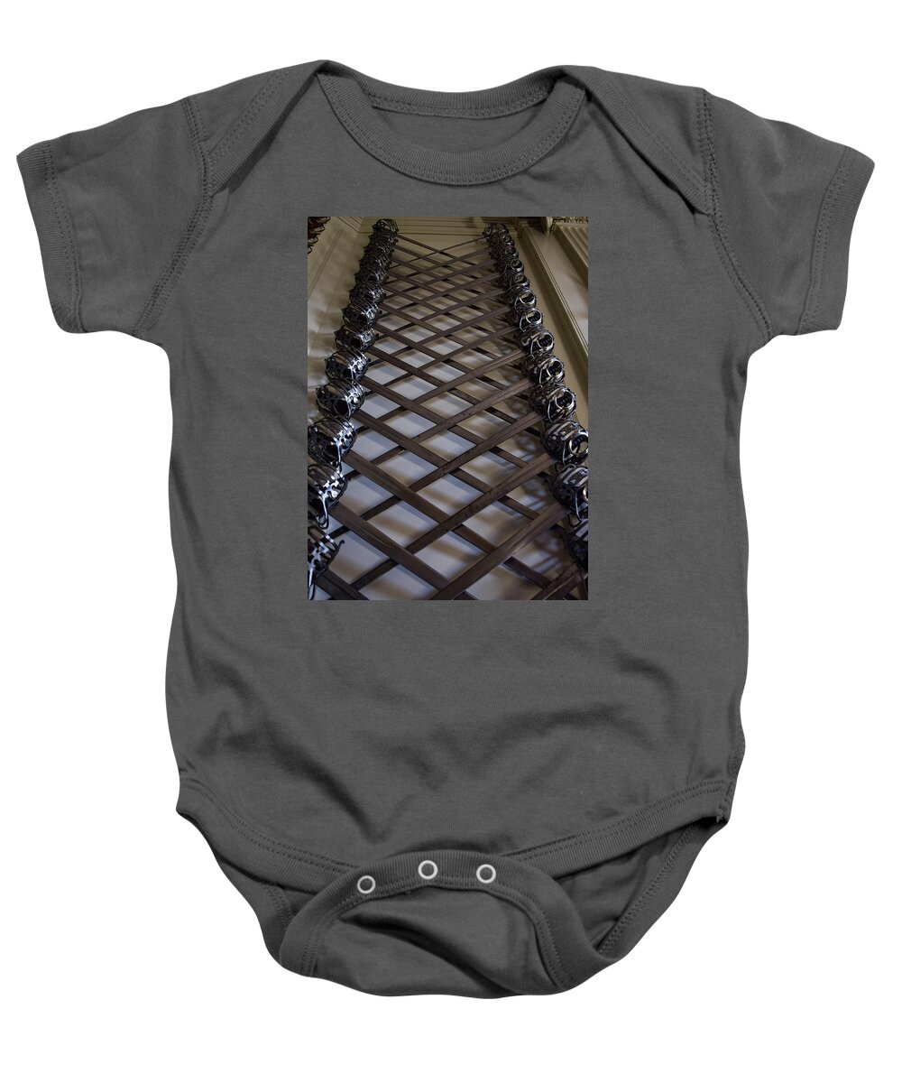 Sword Baby Onesie featuring the photograph Mesmerizing Swords by Nicole Lloyd