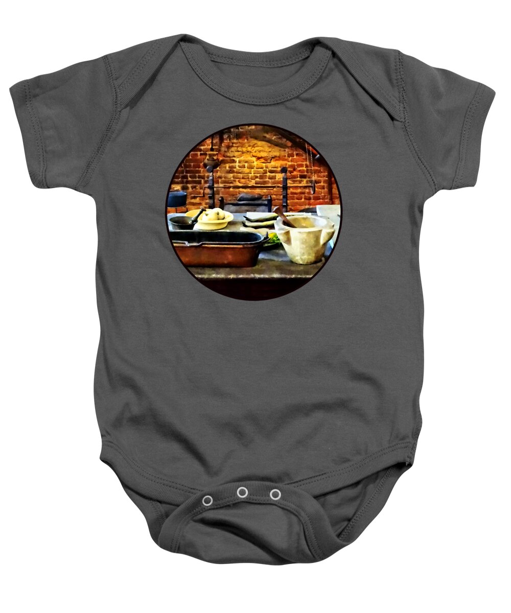 Mortar And Pestle Baby Onesie featuring the photograph Mortar and Pestles in Colonial Kitchen by Susan Savad