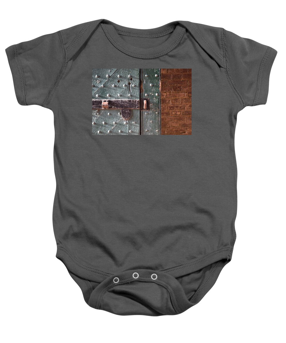 Old Baby Onesie featuring the photograph Old Fort Door by Curtis Krusie
