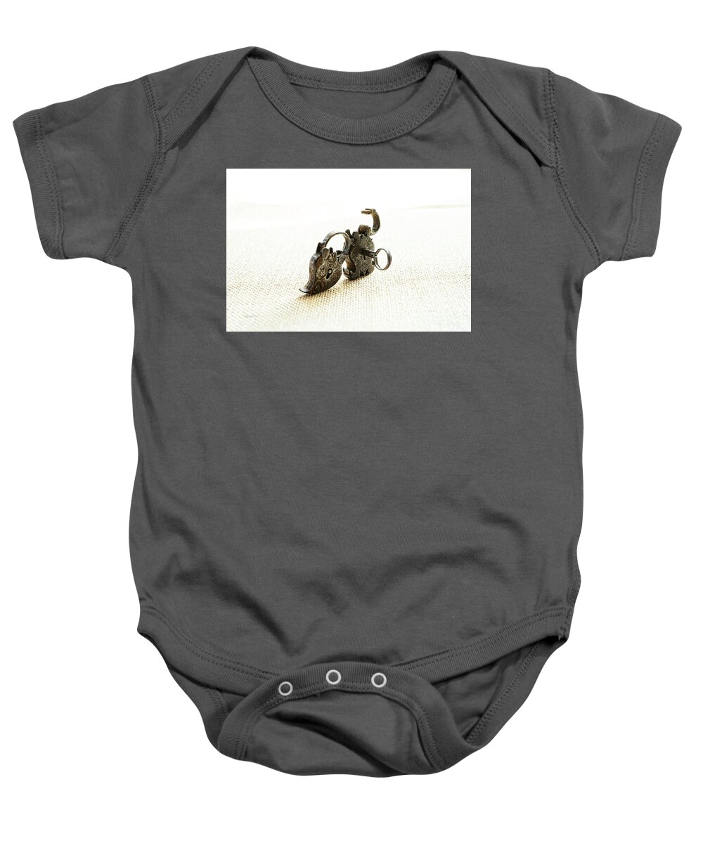 Sharon Popek Baby Onesie featuring the photograph One Open One Closed by Sharon Popek