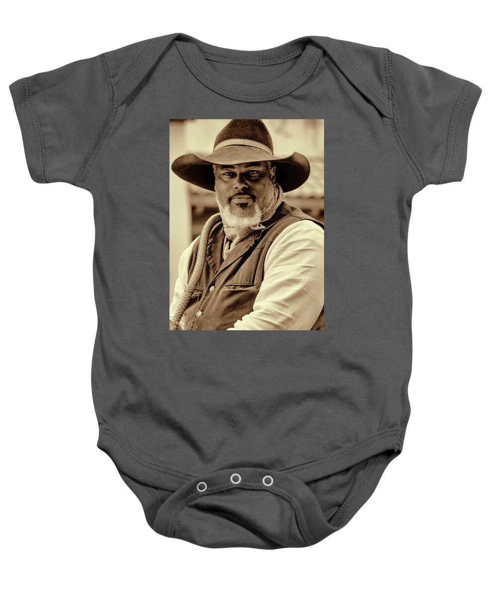 Cowboy Hat Baby Onesie featuring the photograph Piercing Eyes of the Cowboy by Jeanne May