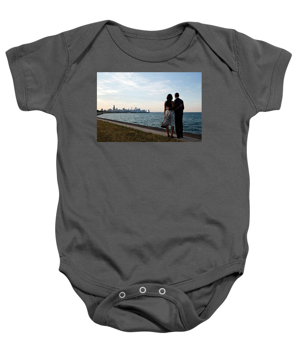 President Baby Onesie featuring the painting President Barack Obama and First Lady Michelle Obama look out at the Chicago, Ill., skyline by Celestial Images