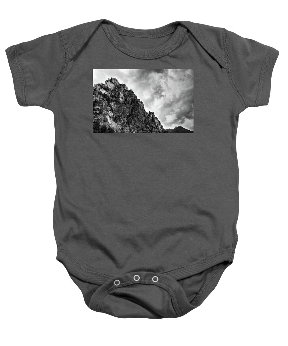 Mountain Baby Onesie featuring the photograph Rocky mountain and stormy cloudy sky by Michalakis Ppalis