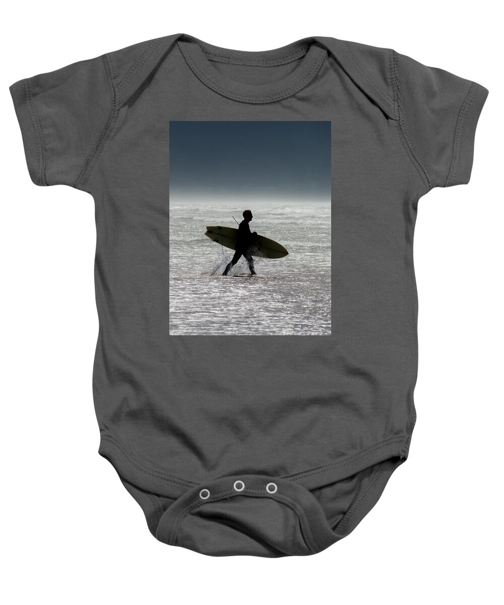 Surfing Baby Onesie featuring the photograph Silhouette Surfer at Beach by Andreas Berthold