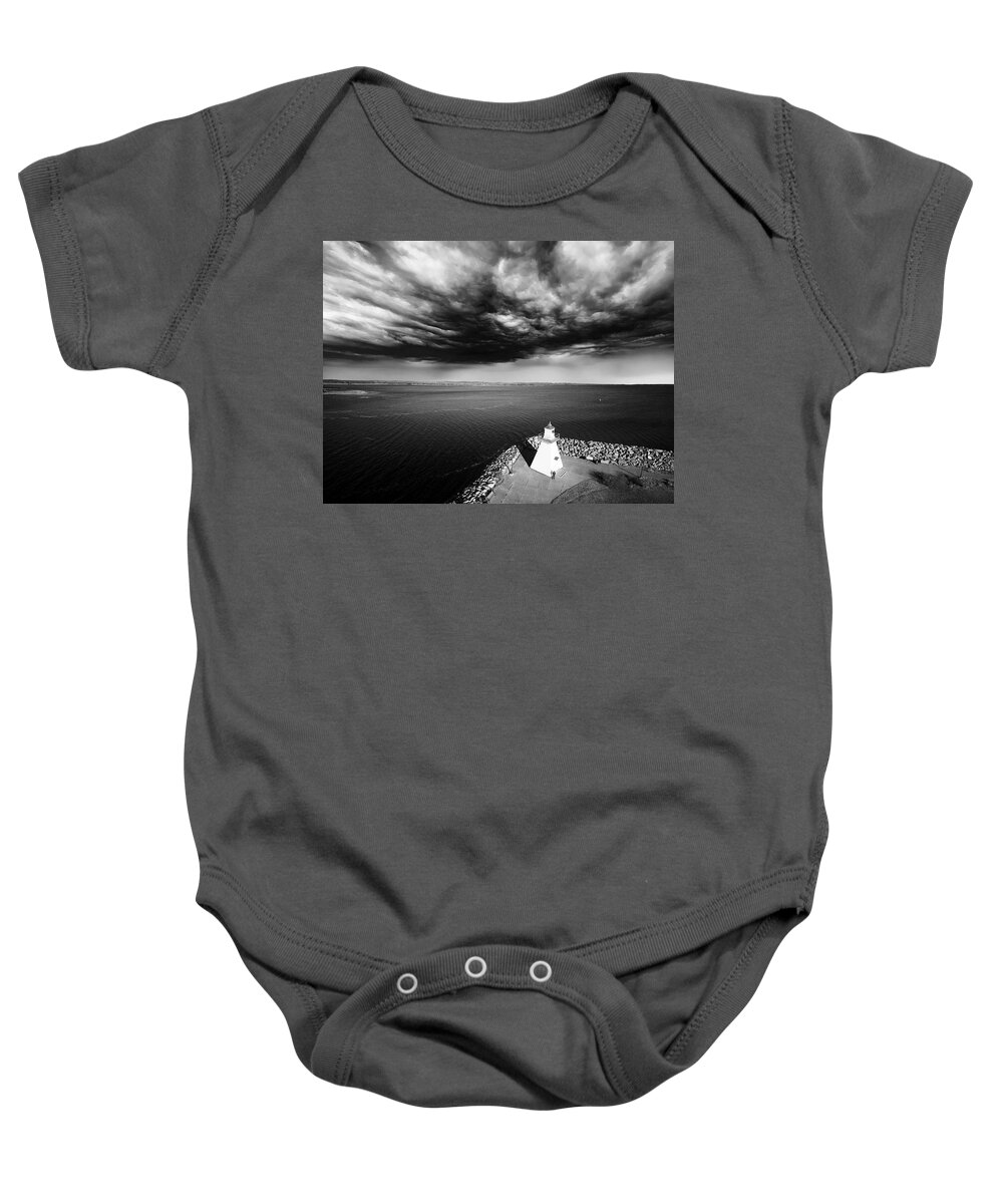 Lighthouse Baby Onesie featuring the digital art Storm Clouds Over a Lighthouse by Julius Reque