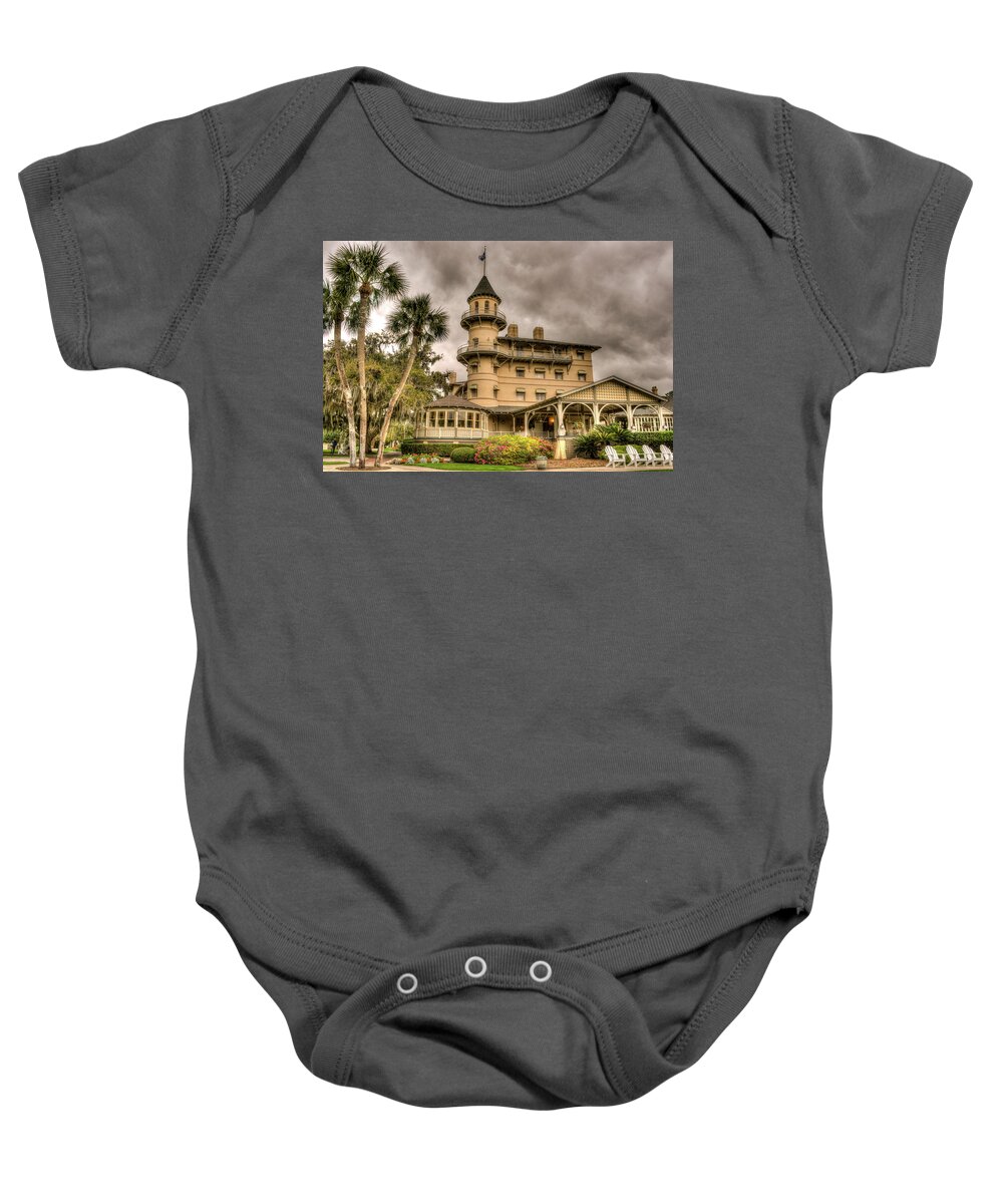 Jekyll Baby Onesie featuring the photograph Storm Clouds Over Jekyll Island Club Hotel by Douglas Barnett