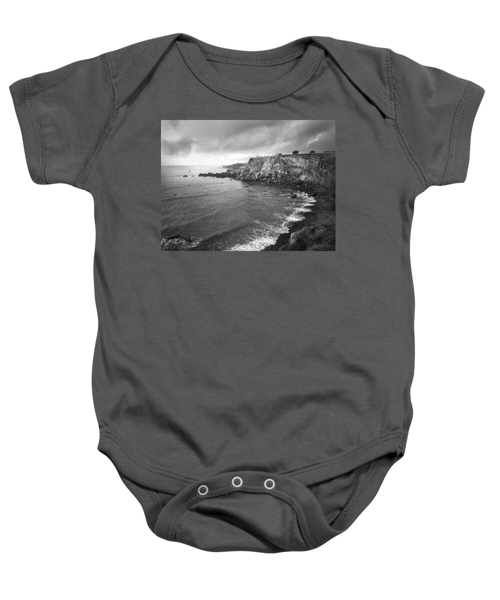 Kelly Hazel Baby Onesie featuring the photograph Storm Over the Eastern Shoreline of Angra do Heroismo Terceira by Kelly Hazel