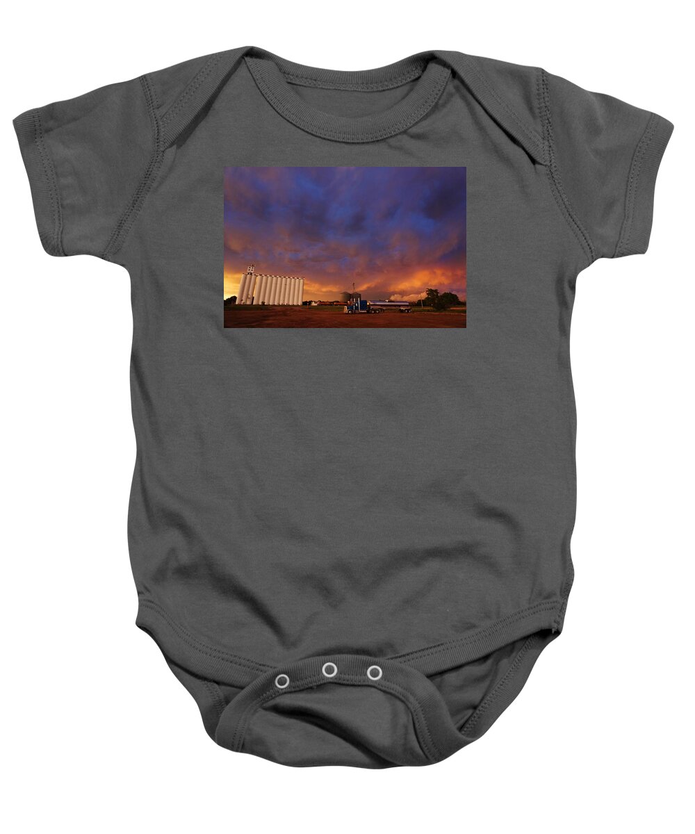 Storm Baby Onesie featuring the photograph Stormy Sunset in Kansas by Ed Sweeney