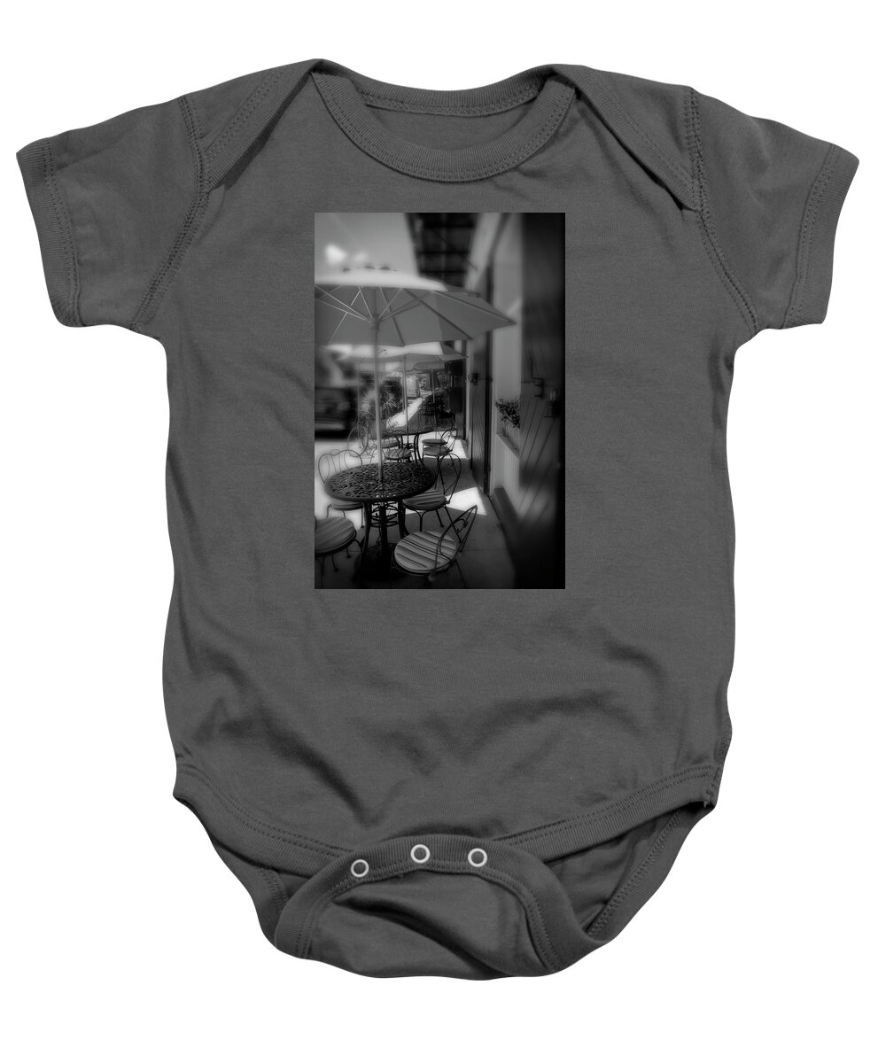 Table Baby Onesie featuring the photograph Table At New Orleans' French Market In Black And White by Greg and Chrystal Mimbs