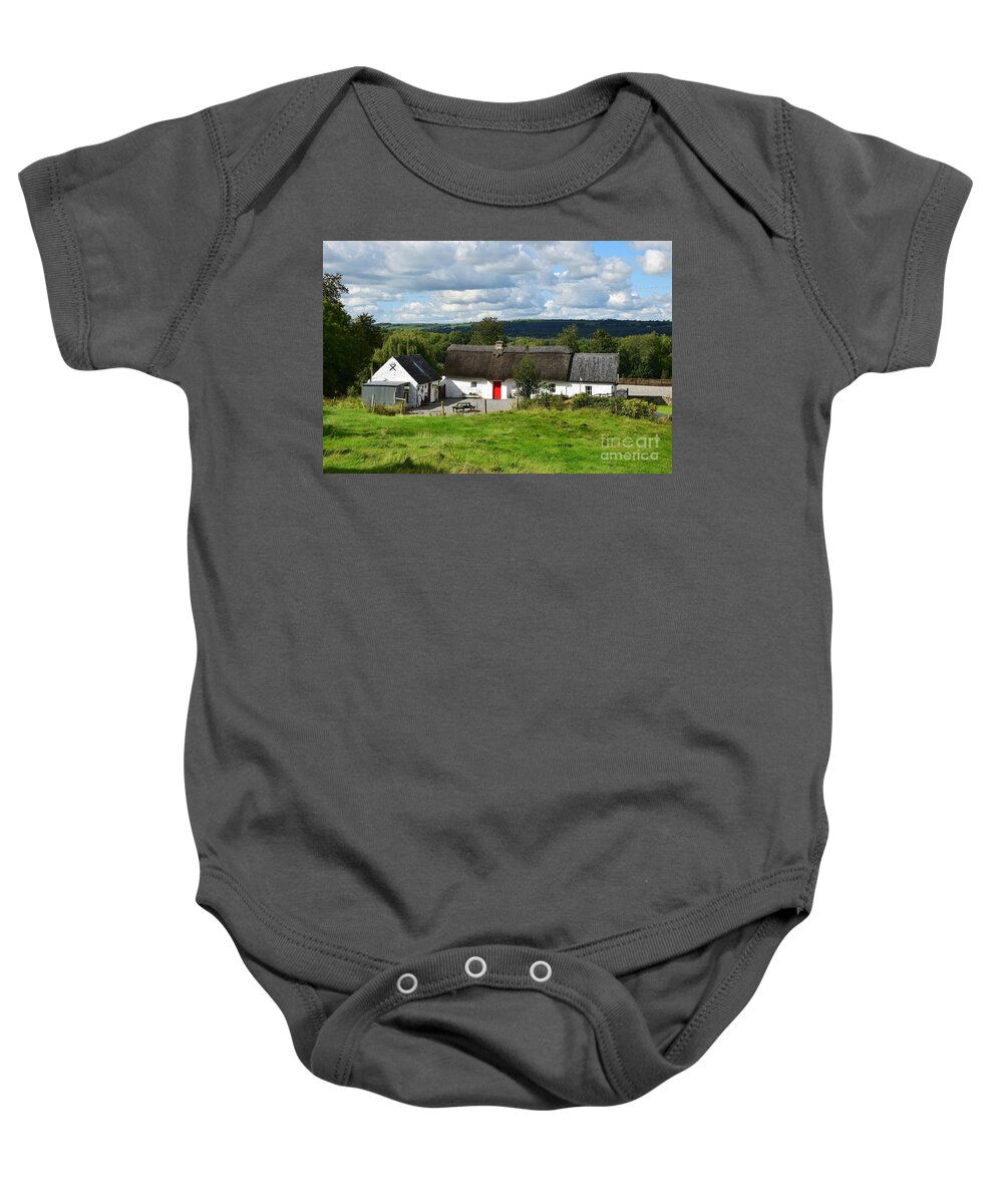 Thatched Cottage Baby Onesie featuring the photograph The Old farm cottage by Joe Cashin