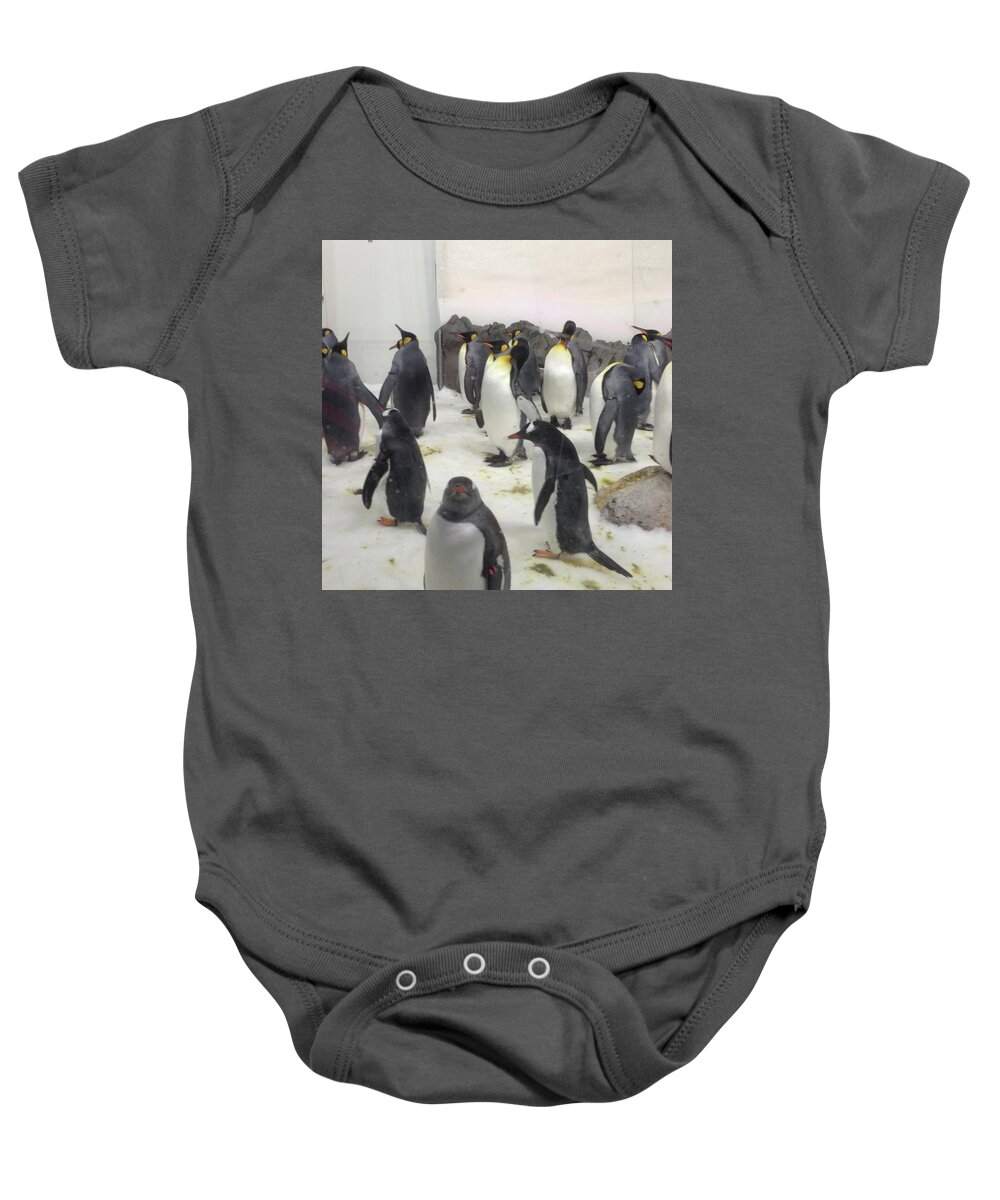 Penguins Baby Onesie featuring the photograph The Parading Penguins by Susan Grunin