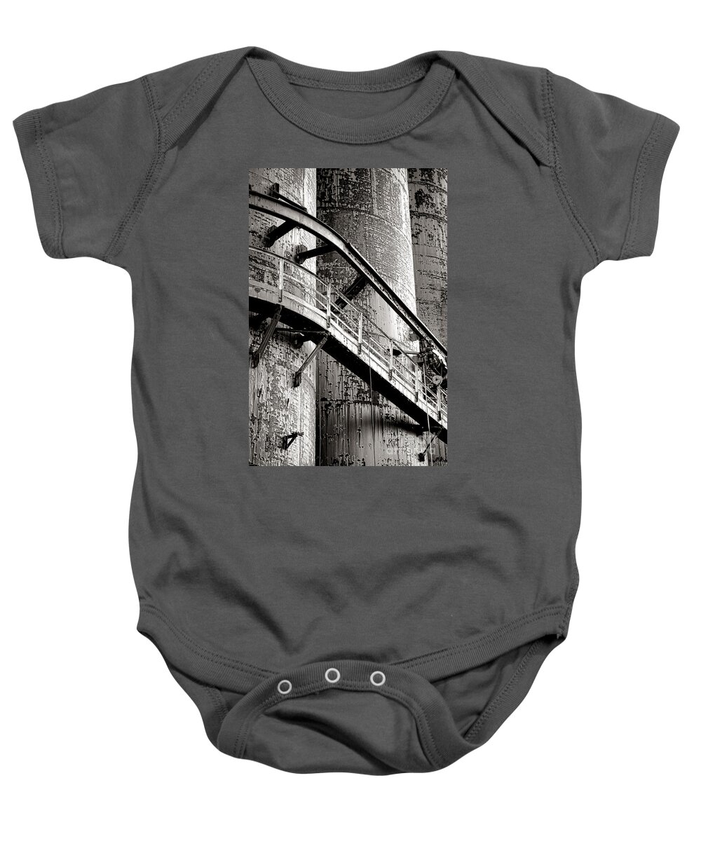 Rusty Baby Onesie featuring the photograph The Steel Citadel by Olivier Le Queinec