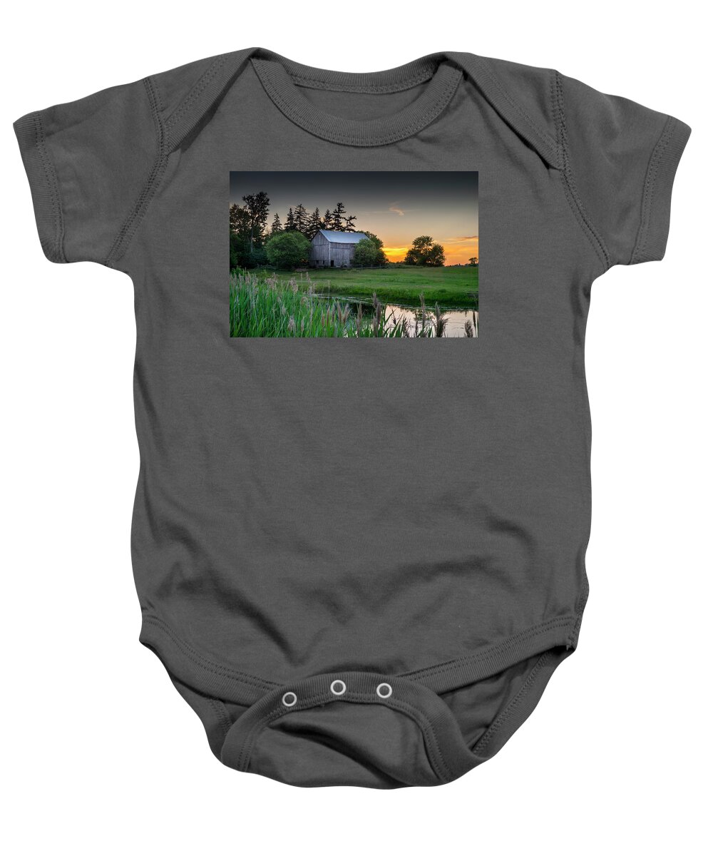 Barn Baby Onesie featuring the photograph The Sunset Behind the Barn by Brent Buchner