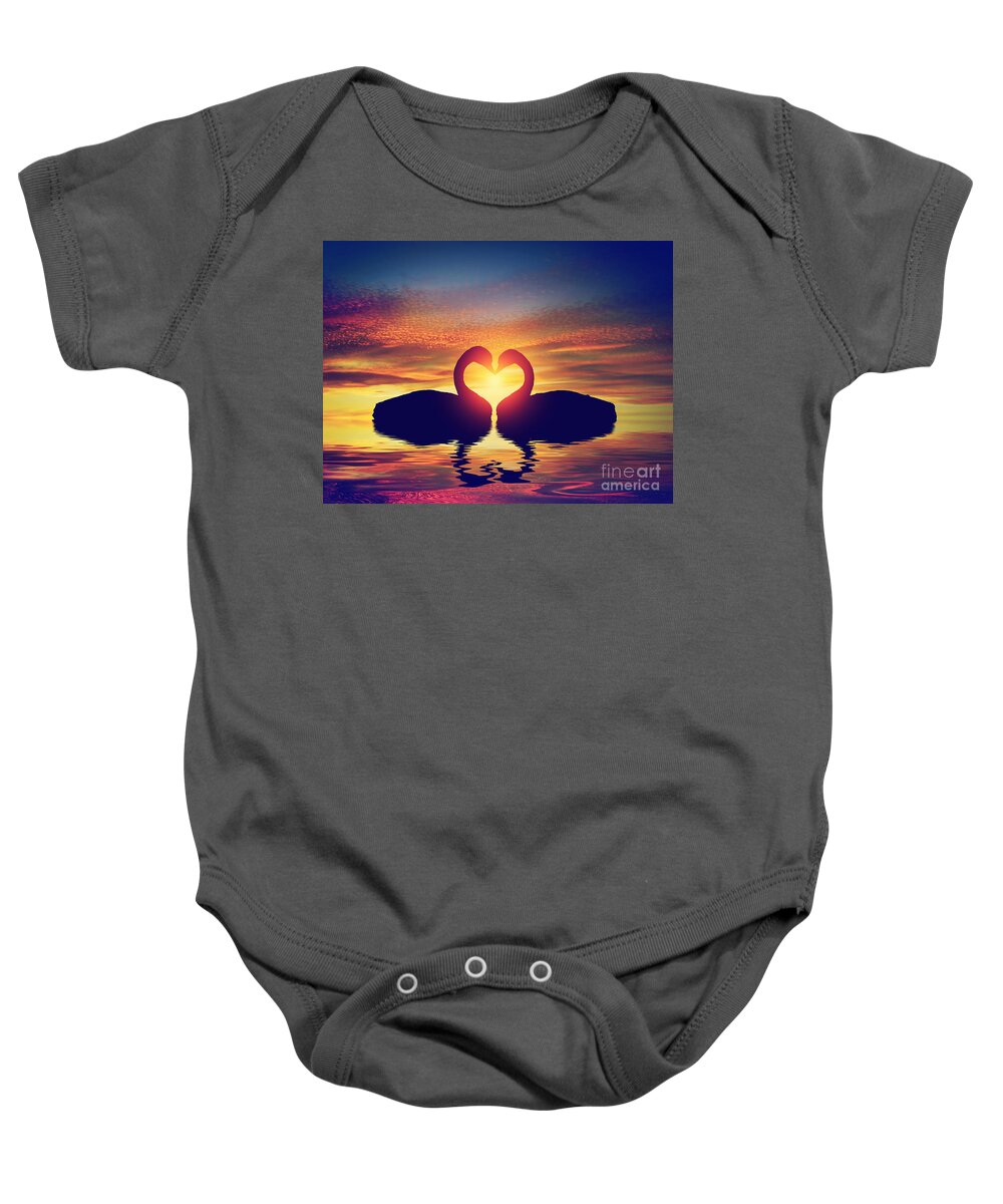 Swan Baby Onesie featuring the photograph Two swans making a heart shape at sunset. Valentine's day by Michal Bednarek