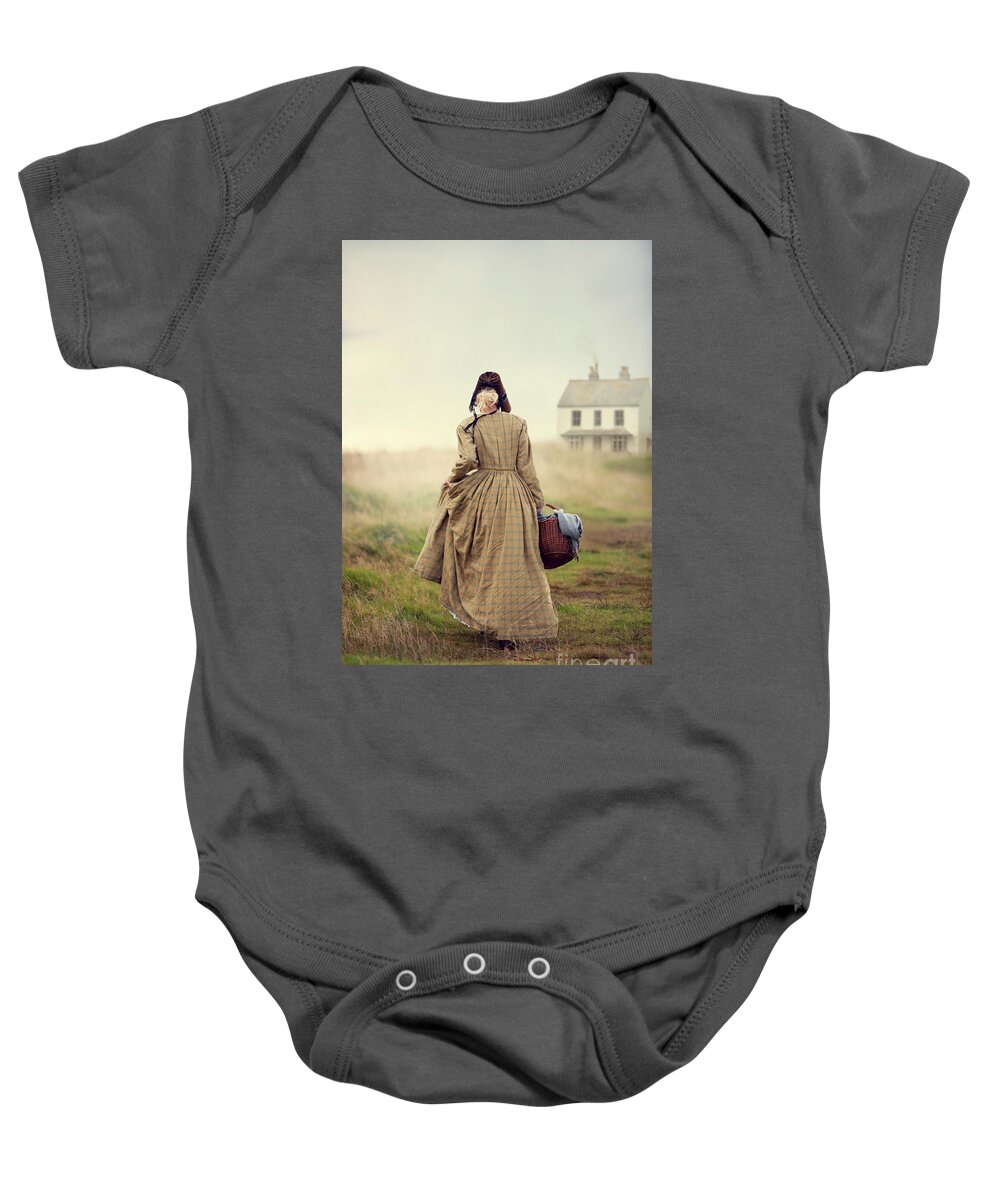 Victorian Baby Onesie featuring the photograph Victorian Woman Walking Towards A Cottage On The Moors by Lee Avison