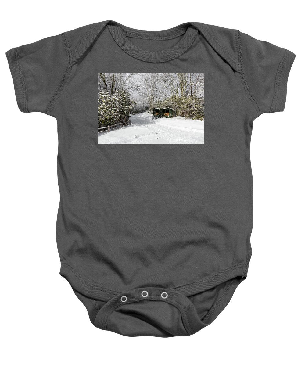Snow Baby Onesie featuring the photograph Wagon Wheels and Firewood by D K Wall