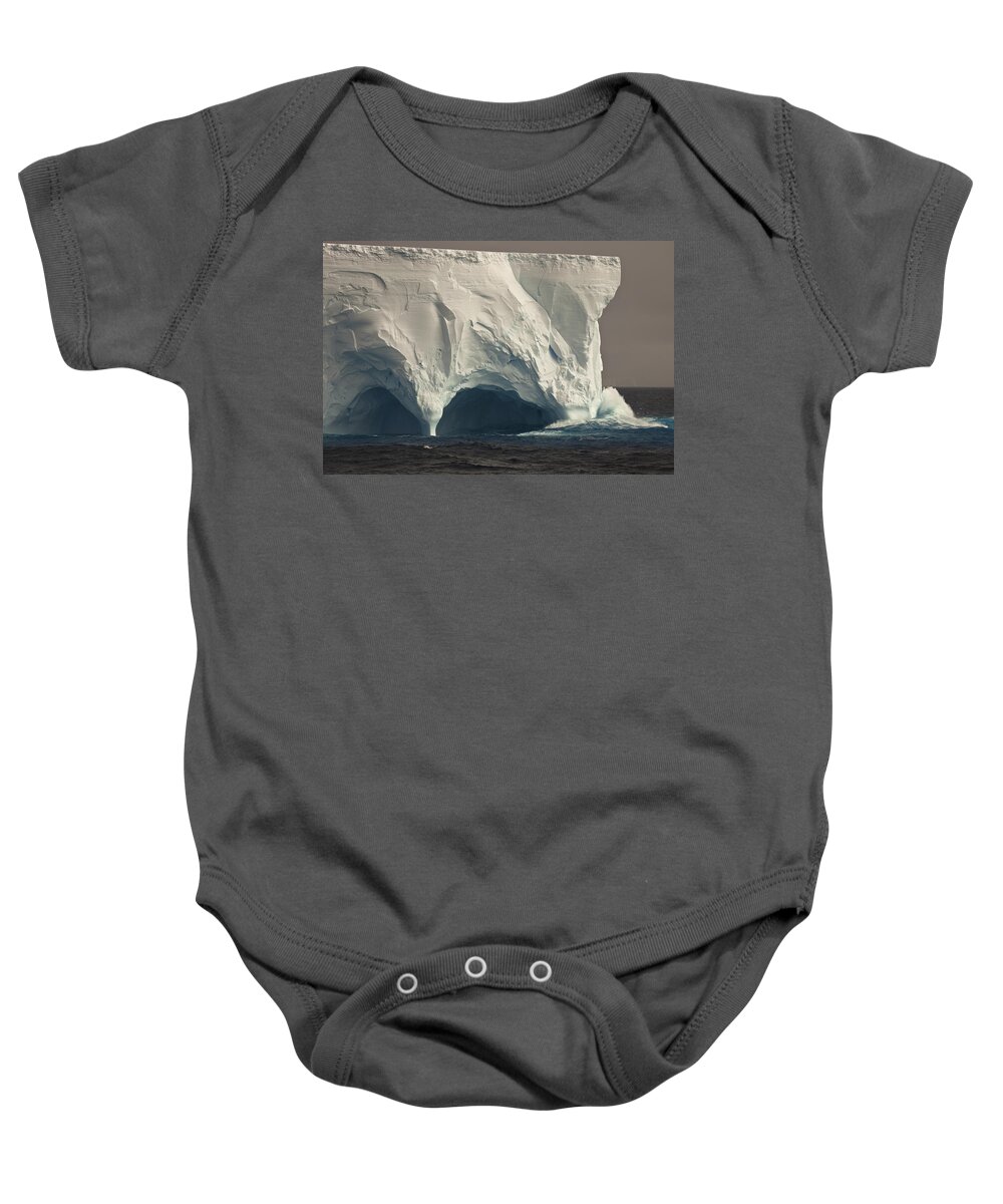 00427971 Baby Onesie featuring the photograph Wave Crashing Into Eroded Tunnel by Colin Monteath