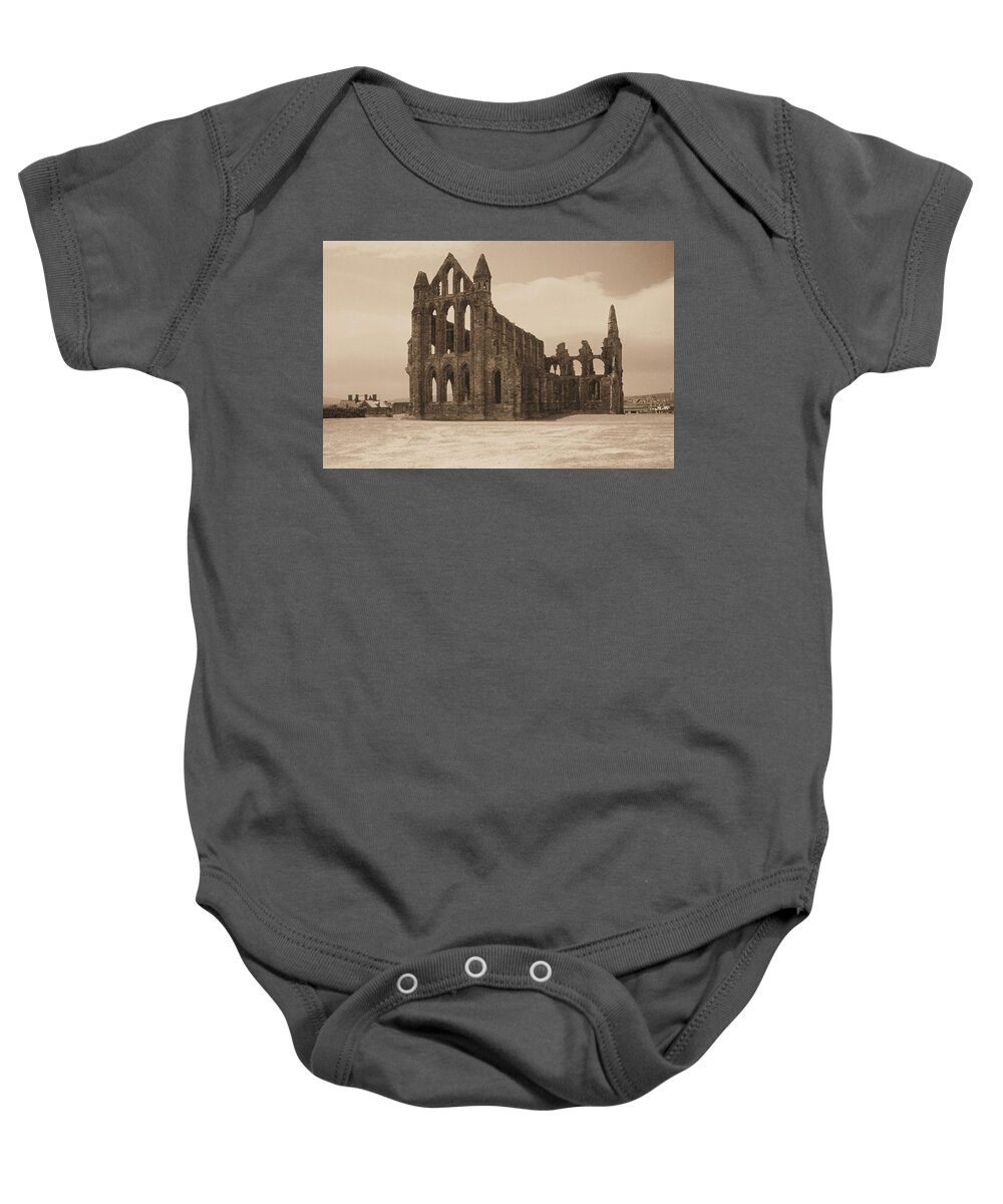 Whitby Abbey England Sepia Old Medieval Middle Ages Church Monastery Nun Nuns Architecture York Yorkshire Monasteries Ruins Saint Century Black Death Building Cathedral Cloister Feudal Benedictine Monk Monks Celtic Bram Stoker Dracula Baby Onesie featuring the photograph Whitby Abbey #33 by Raymond Magnani