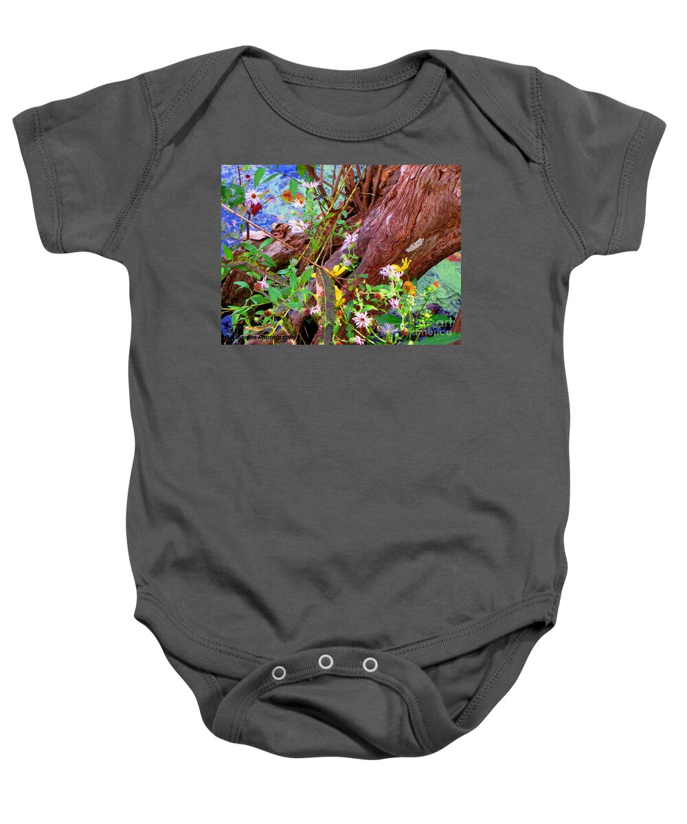 Wildflowers Baby Onesie featuring the photograph Wildflowers on a Cypress Knee by Barbara Bowen