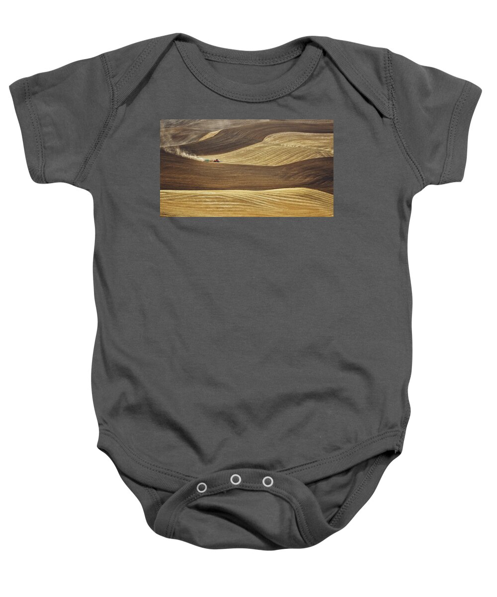 Palouse Baby Onesie featuring the photograph Working the fields in Palouse by Eduard Moldoveanu