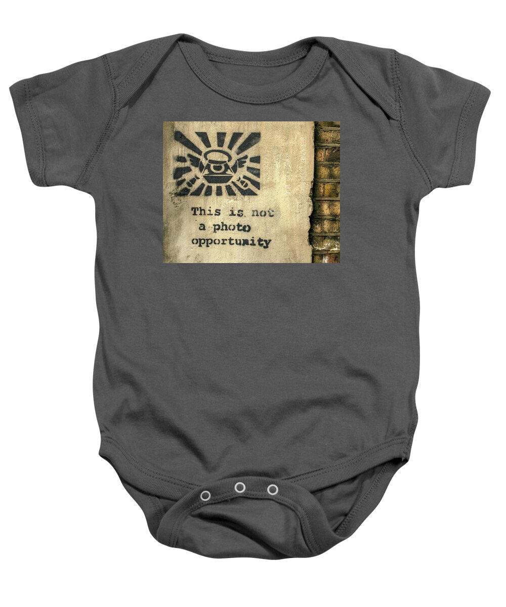 Banksy Baby Onesie featuring the photograph Banksy's This Is Not A Photo Opportunity by Gigi Ebert