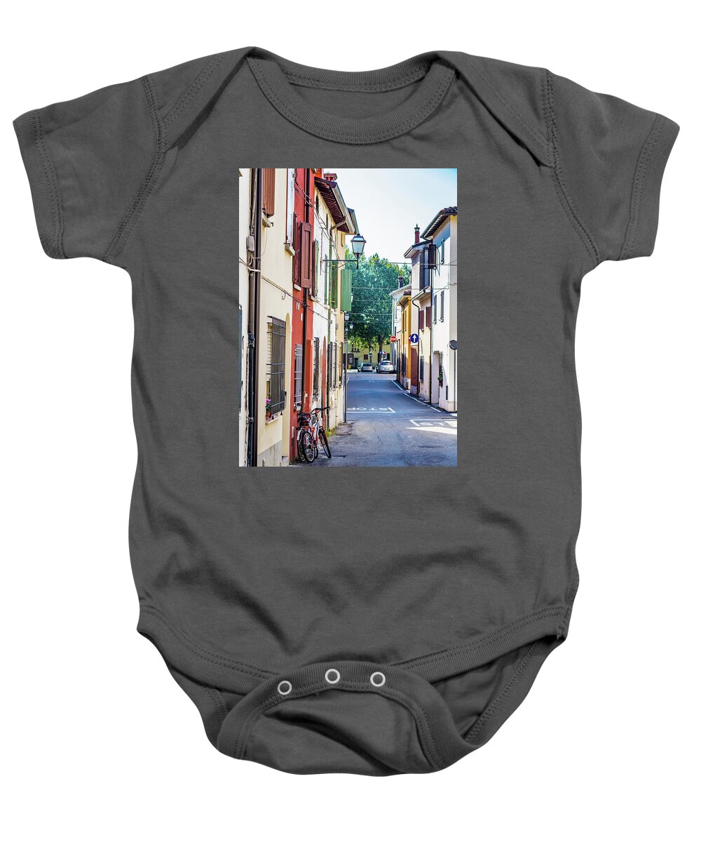 Italy Baby Onesie featuring the photograph Bicycle supported on the wall by Vivida Photo PC
