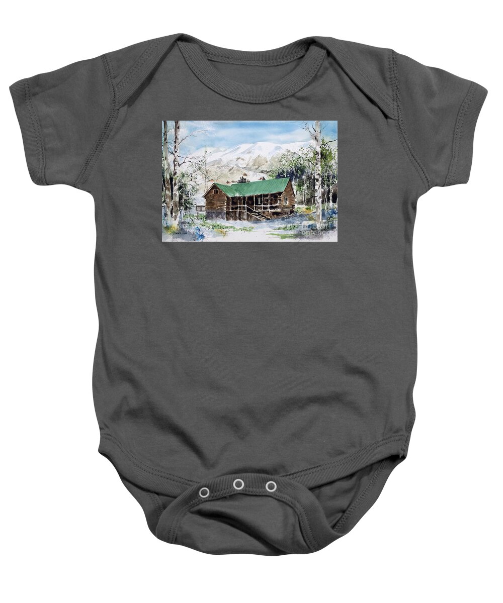A Log Cabin Is Nestled In The Forest In The Mountains Of Colorado. It Is Early Spring. Baby Onesie featuring the painting Colorado Haven by Monte Toon