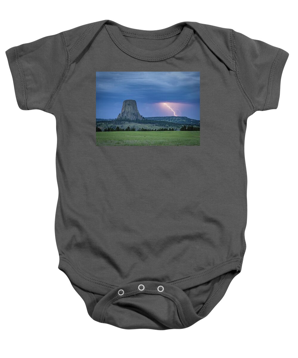 Devils Tower Baby Onesie featuring the photograph Electrifying Night by Laura Hedien