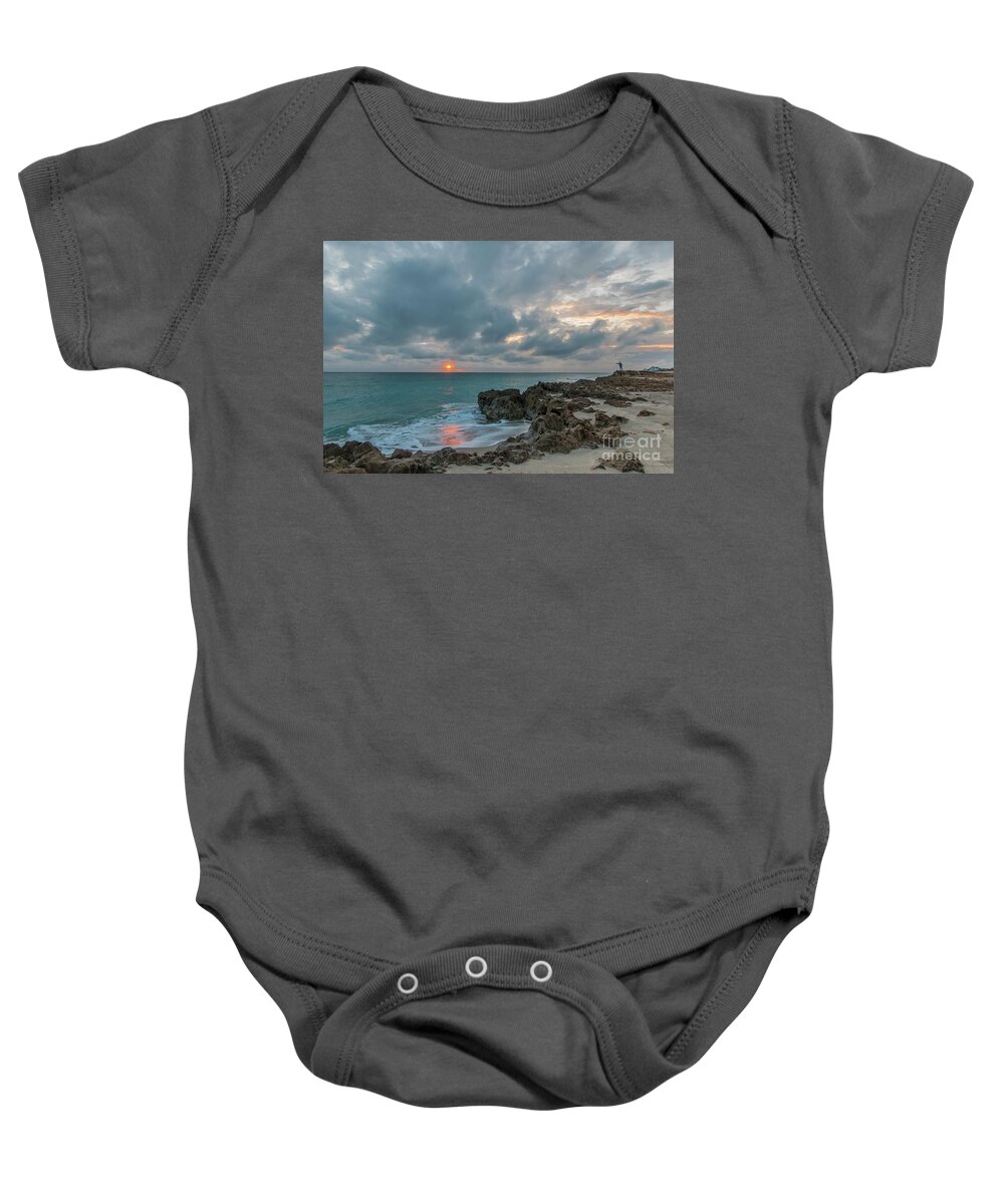Fisherman Baby Onesie featuring the photograph Fisherman on Rocks by Tom Claud