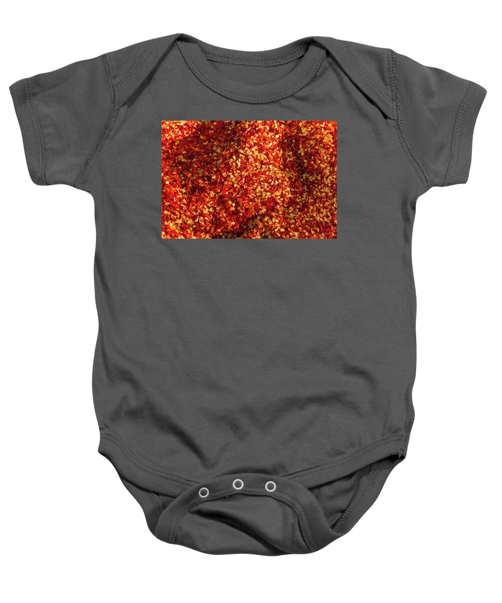 Peppers Baby Onesie featuring the photograph Pepper flakes by Ann Moore