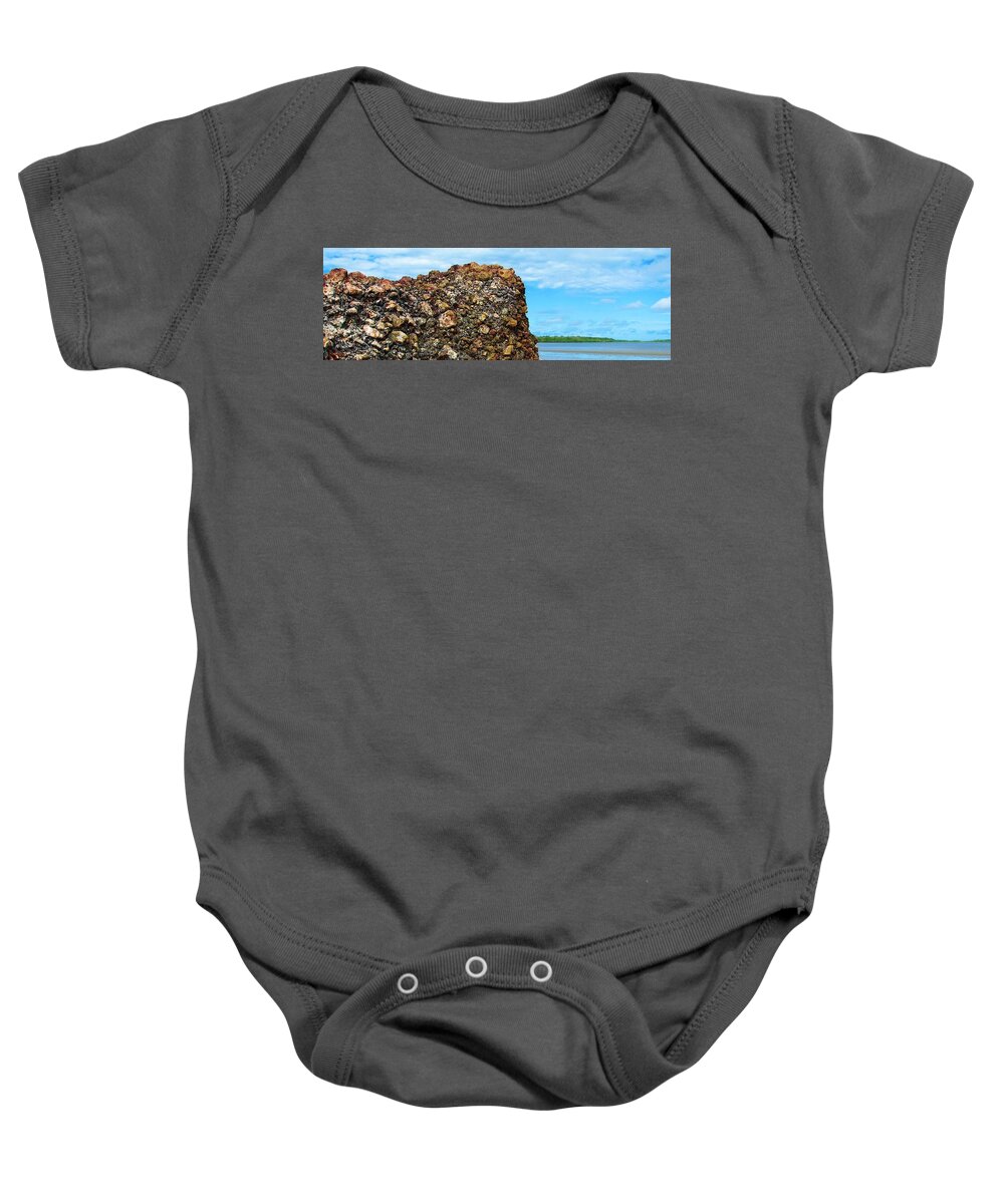 Bwach View Baby Onesie featuring the photograph Rocks and Beach by Joan Stratton