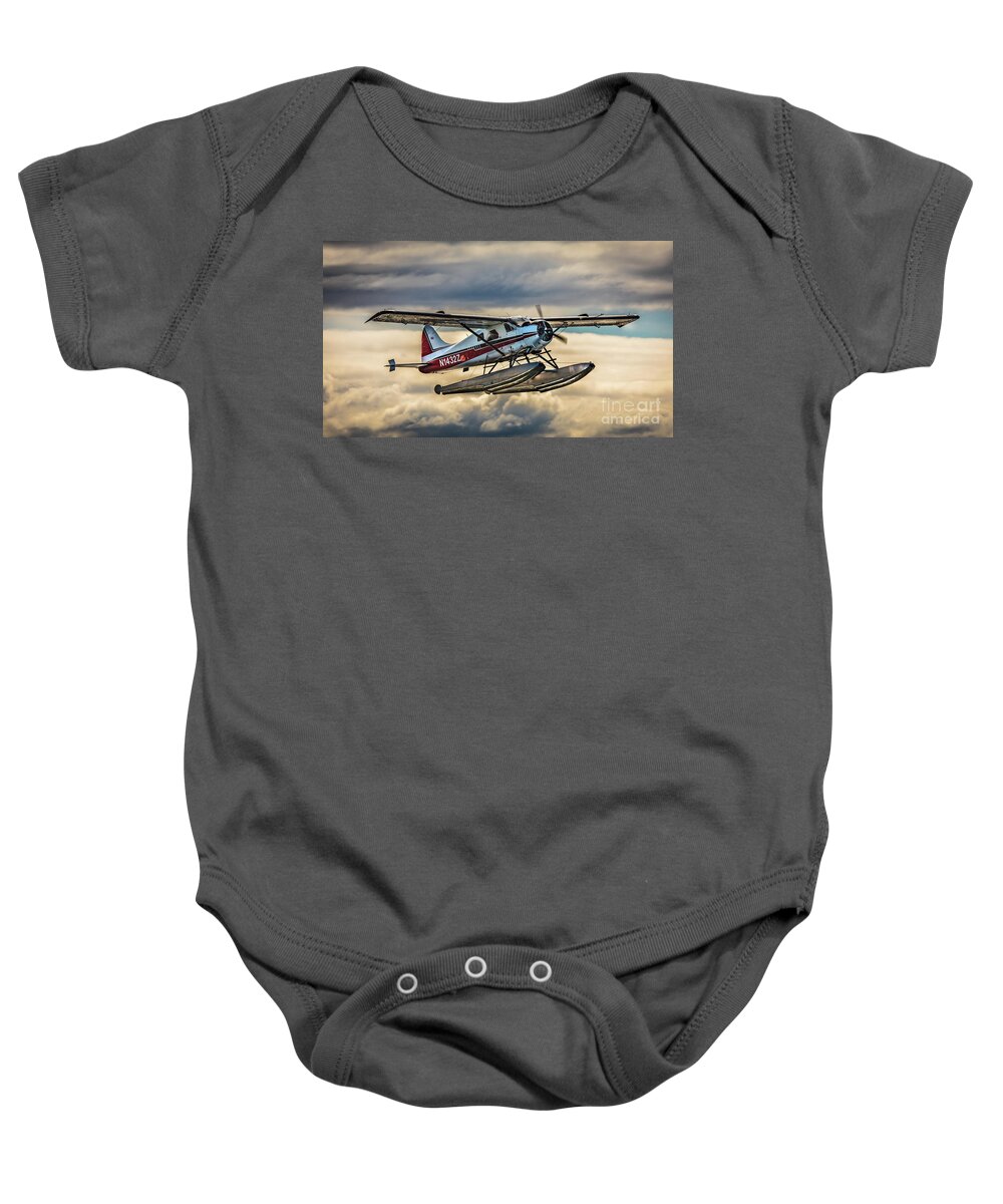 Seaplane Baby Onesie featuring the photograph Seaplane in the Anchorage sky by Lyl Dil Creations
