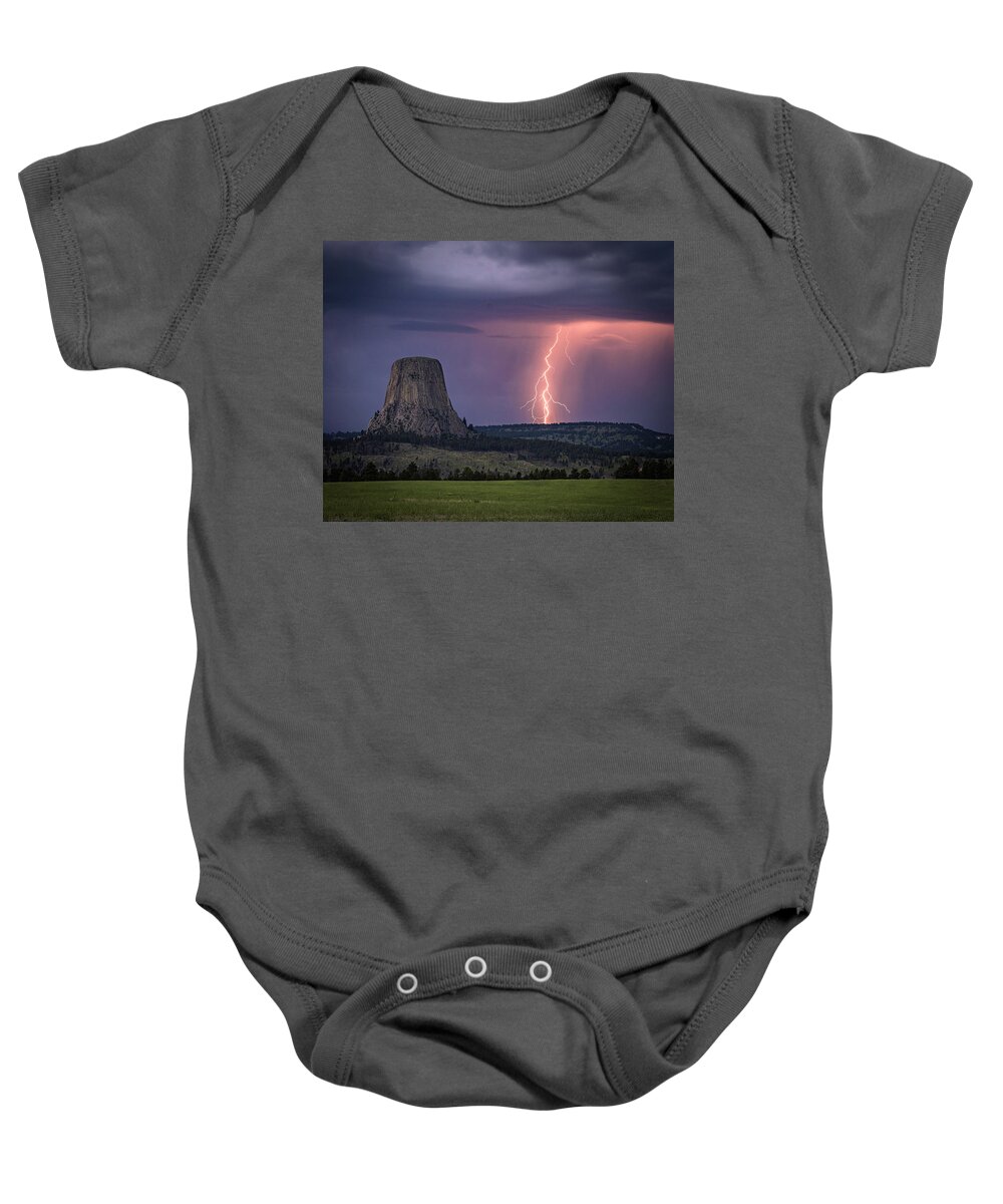 Devils Tower Baby Onesie featuring the photograph Showers and LIghtning by Laura Hedien