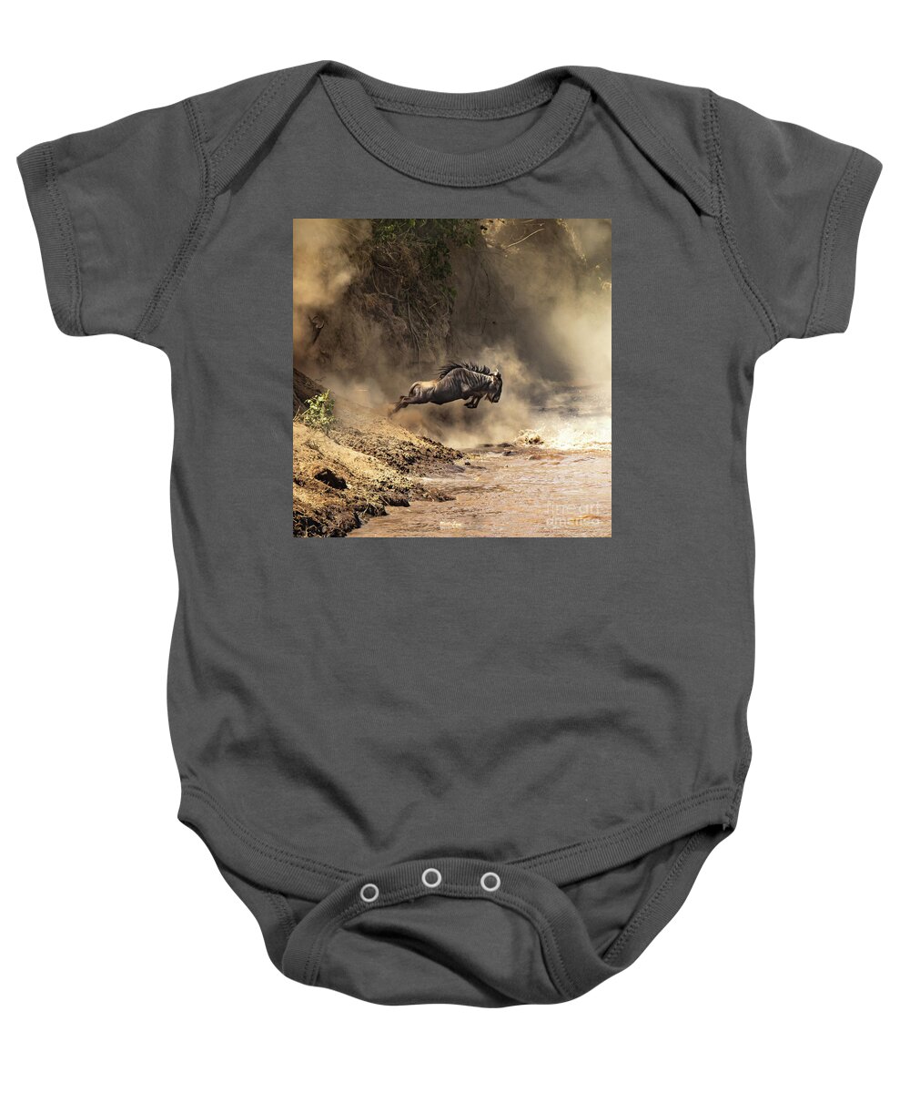 Mara Baby Onesie featuring the photograph Wildebeest leaps from the bank of the Mara river by Jane Rix