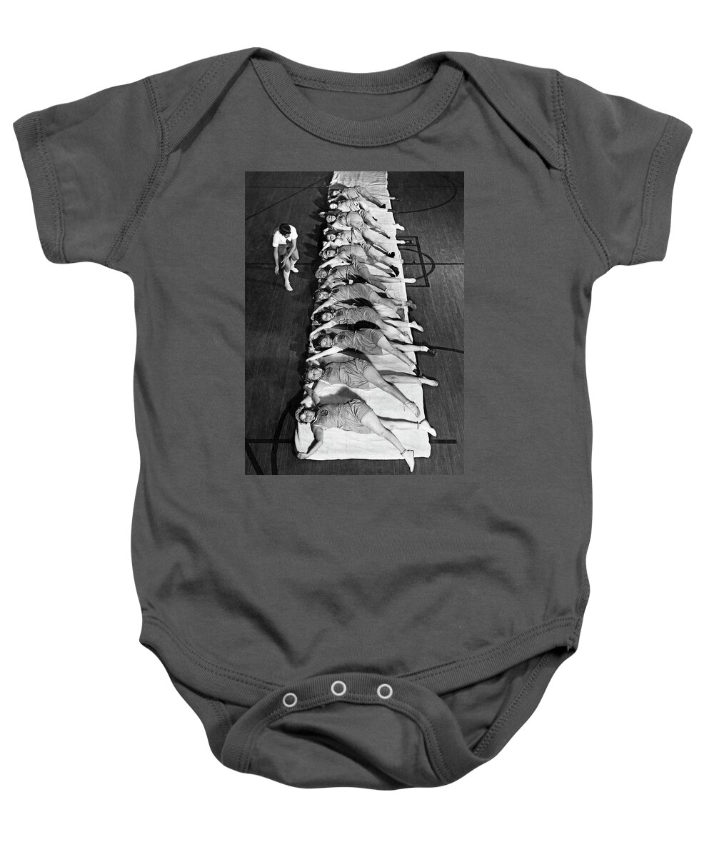 1920s Baby Onesie featuring the photograph Women Exercising Lesson by Underwood Archives
