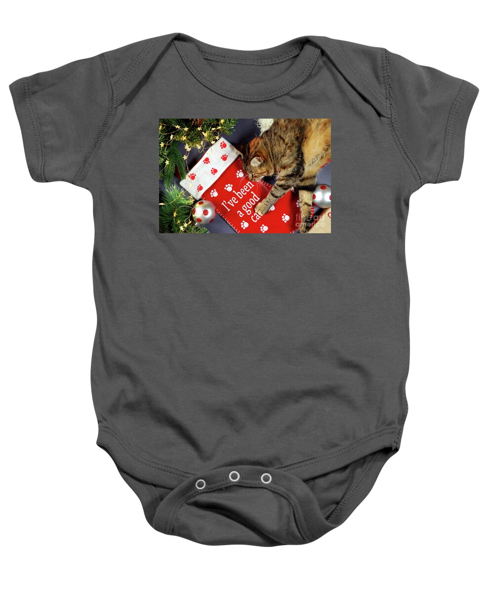 Christmas Baby Onesie featuring the photograph Christmas pet stocking with family cat in festive setting. #1 by Milleflore Images