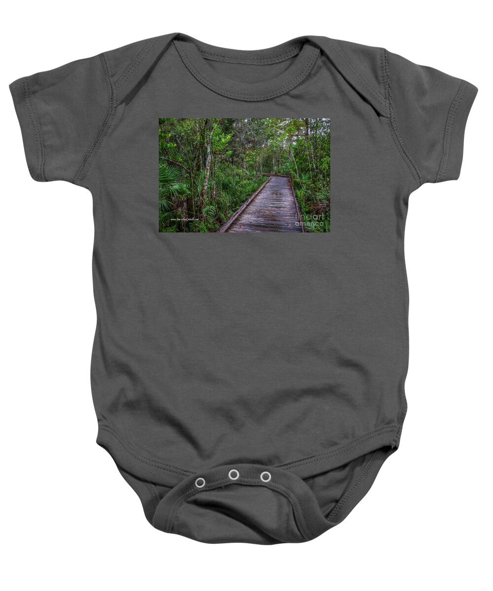 Boardwalk Baby Onesie featuring the photograph Grassy Waters Boardwalk #1 by Tom Claud