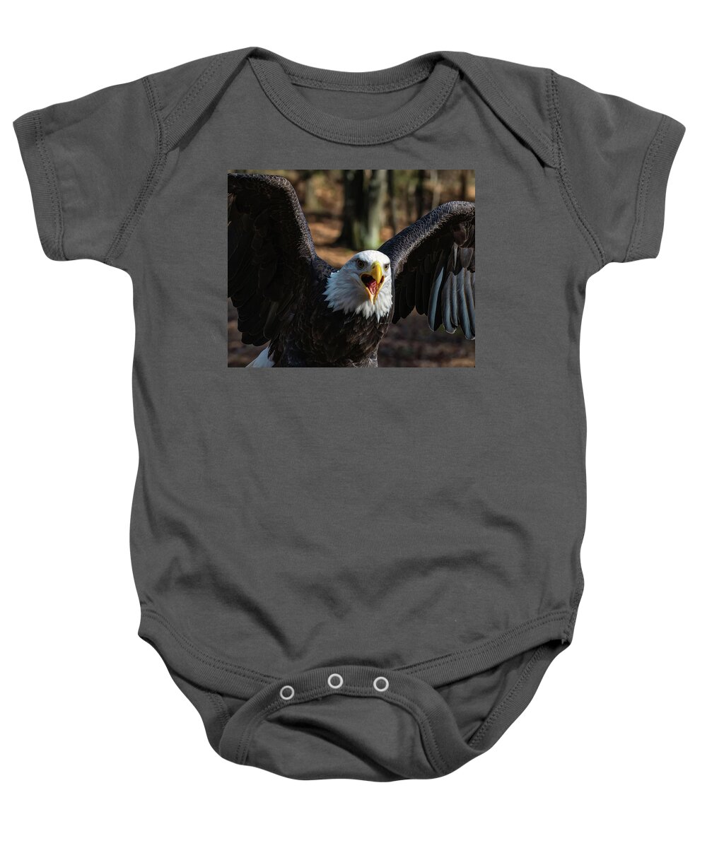 Bald Eagle Baby Onesie featuring the photograph Bald eagle protecting its meal by Flees Photos