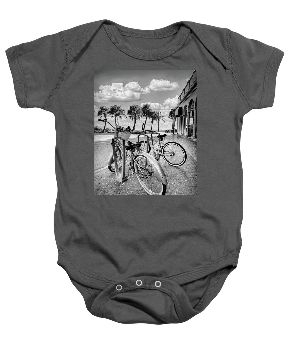 Black Baby Onesie featuring the photograph Bicycles at the Beach Casino Black and White by Debra and Dave Vanderlaan