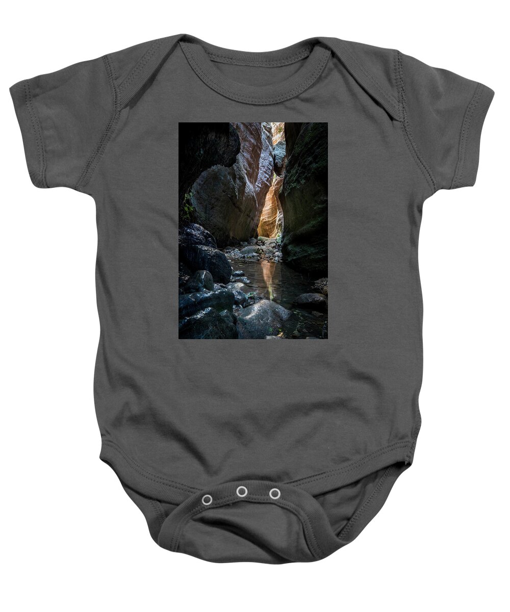 Canyon Baby Onesie featuring the photograph Bright light through the rocks by Michalakis Ppalis