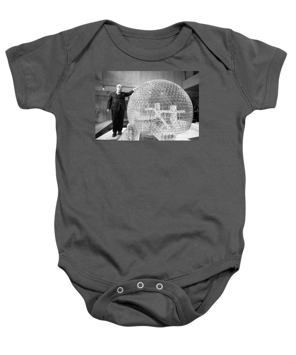 R. Buckminster Fuller Baby Onesie featuring the photograph Buckminster Fuller with a model of the biosphere for the Canadia by The Harrington Collection