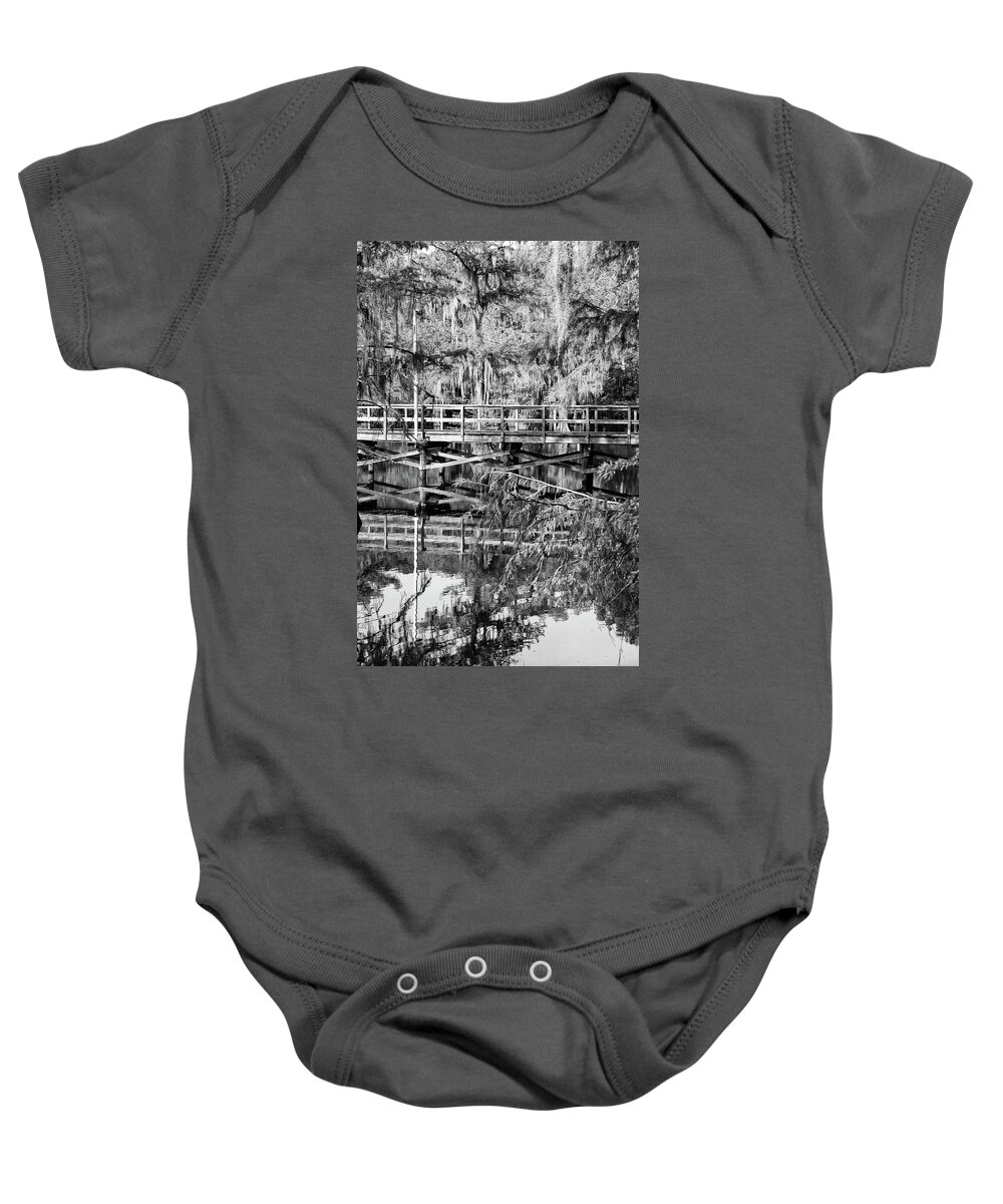 Caddo Lake Baby Onesie featuring the photograph Caddo Lake State Park Mill Pond Wooden Pier Reflection Texas Black and White by Shawn O'Brien