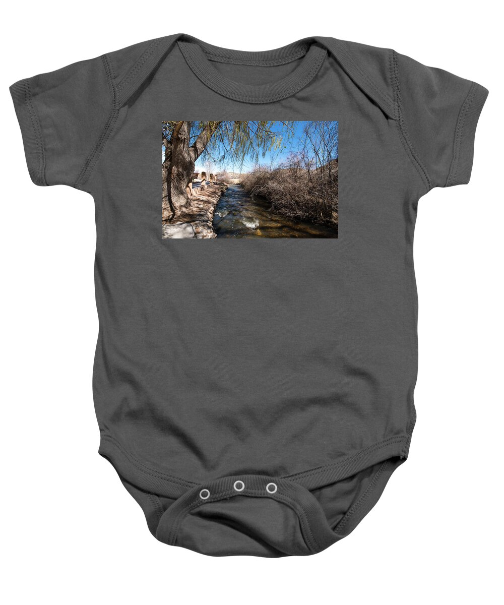 Chimayo Acequia Baby Onesie featuring the photograph Chimayo Acequia by Tom Cochran
