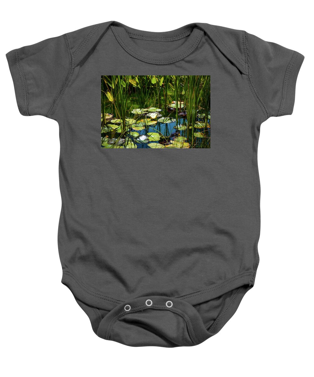 Water Lily Baby Onesie featuring the photograph Deep in the Lily Pond by Bonnie Follett