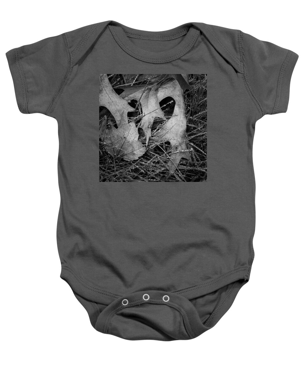 Black Baby Onesie featuring the photograph Fallen Leaves and Dew Drops BW by David Gordon