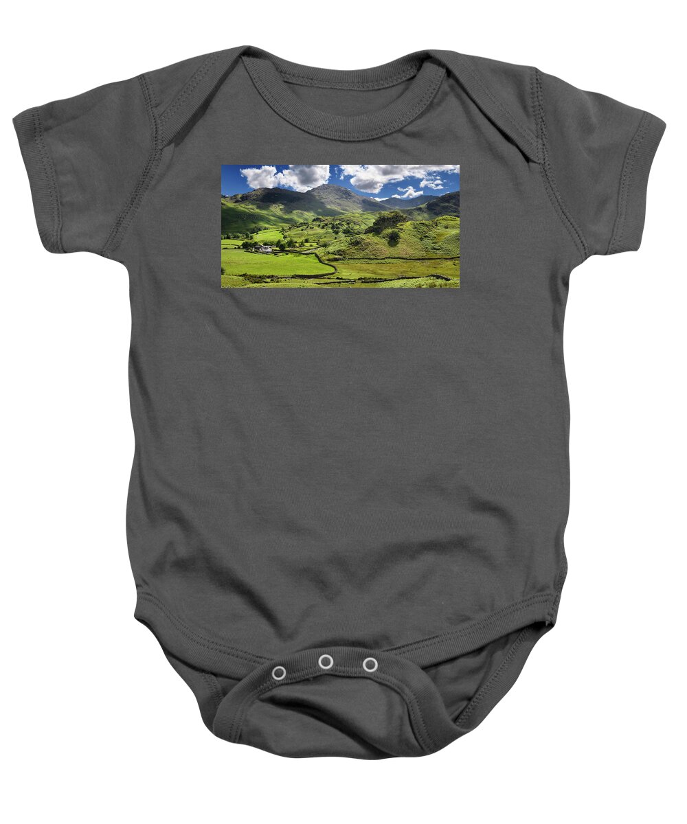 Wrynose Pass Baby Onesie featuring the photograph Fell Foot Farm in Little Langdale valley beside Castle Howe rock by Reimar Gaertner