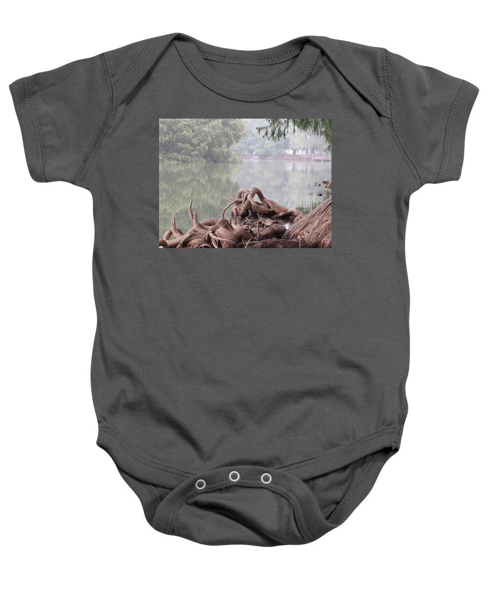  Baby Onesie featuring the pyrography Knarlly Roots by Raymond Fernandez